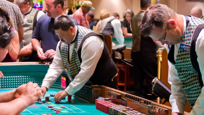 Dealers running a table game for players