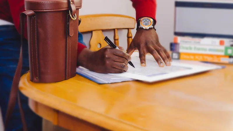 Notes and a pen on a desk